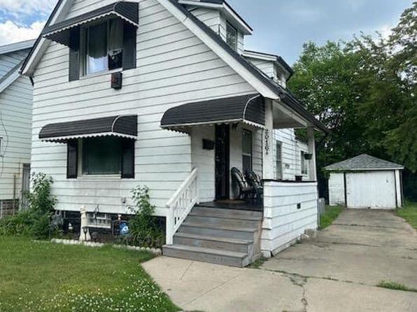 Four-bedroom home with white exterior and porch at 20164 Yacama Ave